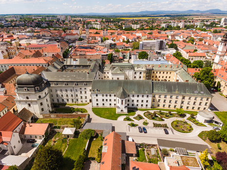 Aerial view of the historic city center with red rooftops the University of Trnava buildings and green courtyards under a clear sky in Trnava Trnava Region Slovakia. Aerial view of the historic city center with red rooftops the University of Trnava buildings and green courtyards under a clear sky in Trnava Trnava Region Slovakia.