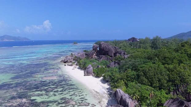Aerial view of Anse Reunion beach and granite boulders Seychelles.