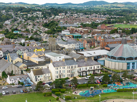 Aerial view of the town of Newcastle featuring historic buildings a prominent church and a public playground in Newcastle Northern Ireland United Kingdom. Aerial view of the town of Newcastle featuring historic buildings a prominent church and a public playground in Newcastle Northern Ireland United Kingdom.