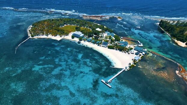 Aerial view of the tropical island of Guanaja and coral reefs Honduras.