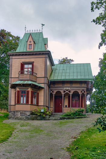 Ronneby Blekinge County Sweden 11 September 2025 View of Villa Vera in Brunssparken featuring its distinctive 19th century wooden architecture green metal roof and ornate porch. Ronneby Blekinge County Sweden 11 September 2025 View of Villa Vera in Brunssparken featuring its distinctive 19th century wooden architecture green metal roof and ornate porch.