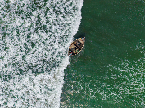 Cox s Bazar Bangladesh 10 March 2026 Aerial view of a traditional wooden fishing boat navigating through turquoise sea water and white crashing waves. Cox s Bazar Bangladesh 10 March 2026 Aerial view of a traditional wooden fishing boat navigating through turquoise sea water and white crashing waves.