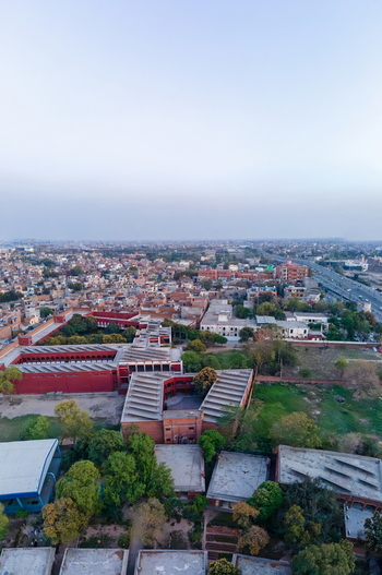 Aerial view of red brick institutional buildings and lush greenery in Lahore Punjab Pakistan. Aerial view of red brick institutional buildings and lush greenery in Lahore Punjab Pakistan.