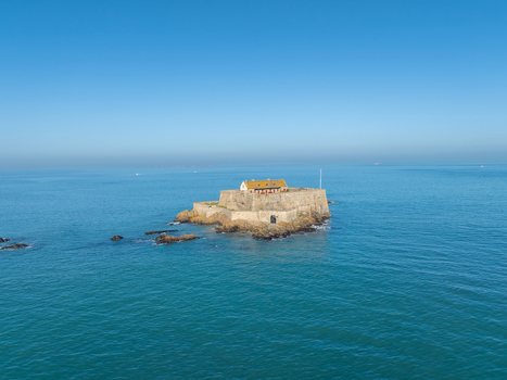 Aerial view of Fort National stands defiant against the turquoise sea a stone sentinel under the clear blue sky Saint Malo Brittany France. Aerial view of Fort National stands defiant against the turquoise sea a stone sentinel under the clear blue sky Saint Malo Brittany France.