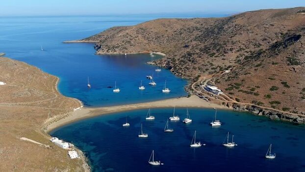 Aerial view of a double sided bay with sailboats in Greece. Aerial view of a double sided bay with sailboats in Greece.