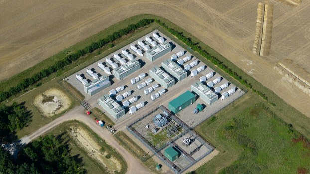 Aerial view of Pelham Storage Limited a battery energy storage facility with rows of white containers and transformers in Bishop s Stortford England United Kingdom. Aerial view of Pelham Storage Limited a battery energy storage facility with rows of white containers and transformers in Bishop s Stortford England United Kingdom.