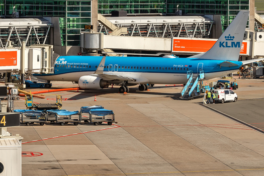 Schiphol Netherlands 16 April 2026 View of a KLM Royal Dutch Airlines Boeing 737 aircraft parked at a boarding gate with ground service equipment and crew at Amsterdam Airport Schiphol. Schiphol Netherlands 16 April 2026 View of a KLM Royal Dutch Airlines Boeing 737 aircraft parked at a boarding gate with ground service equipment and crew at Amsterdam Airport Schiphol.