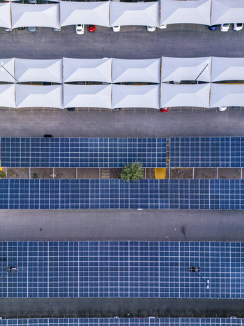 Aerial view of solar panel parking structures providing shade for cars in a parking lot in the city Chihuahua Chihuahua Mexico. Aerial view of solar panel parking structures providing shade for cars in a parking lot in the city Chihuahua Chihuahua Mexico.