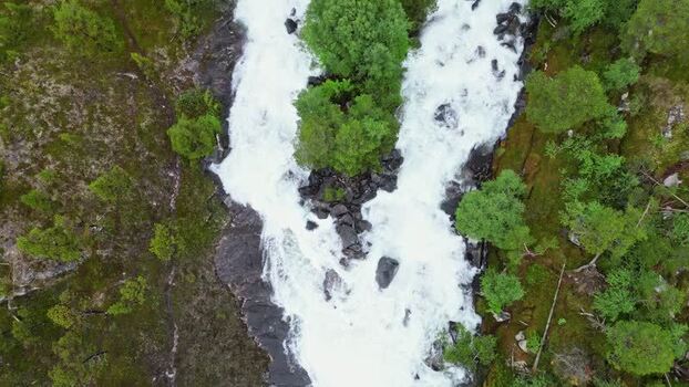 Aerial view of Kjemafossen waterfall and forest Norway.
