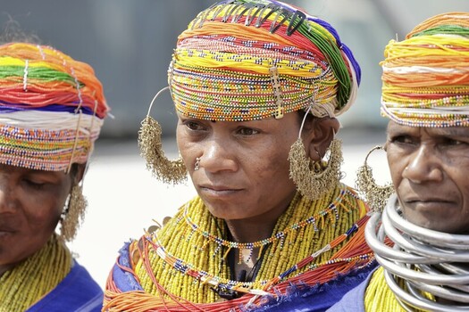 Odisha India 26 March 2026 View of tribal women adorned in vibrant beaded headdresses and intricate jewelry their faces etched with deep lines under the bright sun. Odisha India 26 March 2026 View of tribal women adorned in vibrant beaded headdresses and intricate jewelry their faces etched with deep lines under the bright sun.