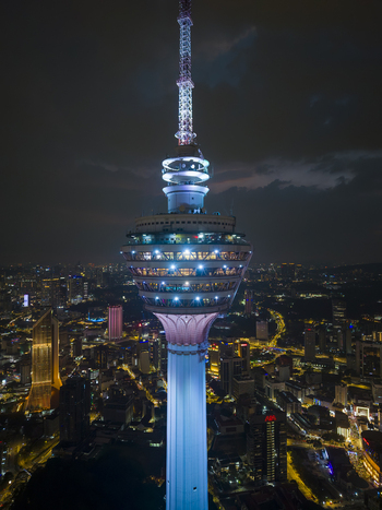 Kuala Lumpur Malaysia 11 March 2026 Aerial view of Menara Kuala Lumpur illuminated against the night city skyline with glowing urban lights.