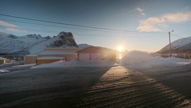View of snowy buildings and mountains Norway.