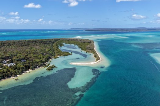 Aerial view of Moreton Island featuring turquoise waters sandbars and dense vegetation in Kooringal Queensland Australia. Aerial view of Moreton Island featuring turquoise waters sandbars and dense vegetation in Kooringal Queensland Australia.