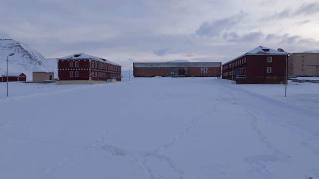 Aerial view of Pyramiden buildings in snow Svalbard and Jan Mayen.