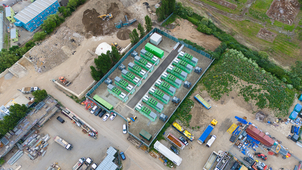 Aerial view of Damhead Creek Power Station Battery Energy Storage Systems BESS with rows of green containers and industrial equipment Rochester England United Kingdom. Aerial view of Damhead Creek Power Station Battery Energy Storage Systems BESS with rows of green containers and industrial equipment Rochester England United Kingdom.