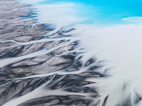 Aerial view of glacial rivers carving through the landscape a stark contrast between the milky waters and dark earth Lake Tekapo Canterbury Region New Zealand. Aerial view of glacial rivers carving through the landscape a stark contrast between the milky waters and dark earth Lake Tekapo Canterbury Region New Zealand.
