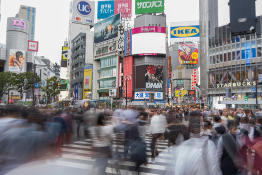Tokyo Japan 01 October 2025 View of the iconic Shibuya Crossing alive with a blur of pedestrians beneath a vibrant tapestry of towering billboards and advertisements. Tokyo Japan 01 October 2025 View of the iconic Shibuya Crossing alive with a blur of pedestrians beneath a vibrant tapestry of towering billboards and advertisements.