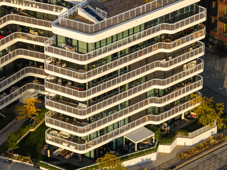 Aerial view of the modern apartment building at Spreespeicher Promenade with its distinctive curved balconies and glass facades in Berlin Berlin Germany. Aerial view of the modern apartment building at Spreespeicher Promenade with its distinctive curved balconies and glass facades in Berlin Berlin Germany.