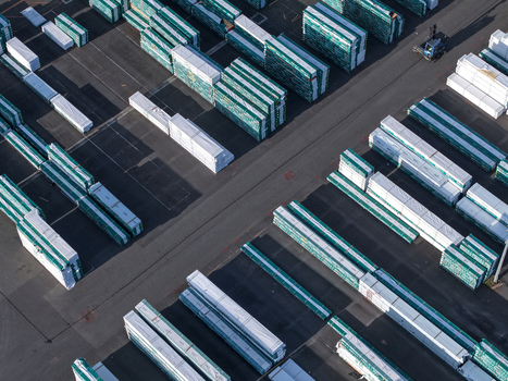 Melbourne Australia 22 September 2026 Aerial view of industrial storage area in Kilsyth with rows of stacked construction materials and a forklift operating in the yard. Melbourne Australia 22 September 2026 Aerial view of industrial storage area in Kilsyth with rows of stacked construction materials and a forklift operating in the yard.
