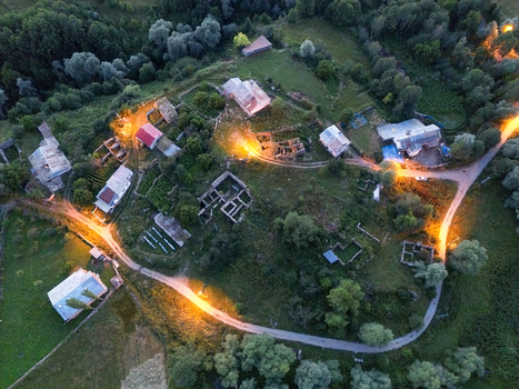 Aerial view of rustic buildings nestled among lush greenery illuminated by warm golden light creating a serene and inviting atmosphere Posof Ardahan Türkiye. Aerial view of rustic buildings nestled among lush greenery illuminated by warm golden light creating a serene and inviting atmosphere Posof Ardahan Türkiye.
