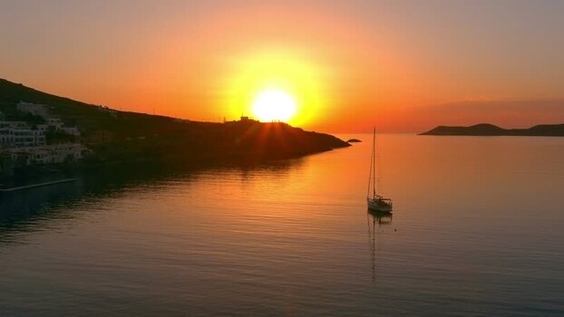 Aerial view of a sailboat in a bay at sunset Greece. Aerial view of a sailboat in a bay at sunset Greece.
