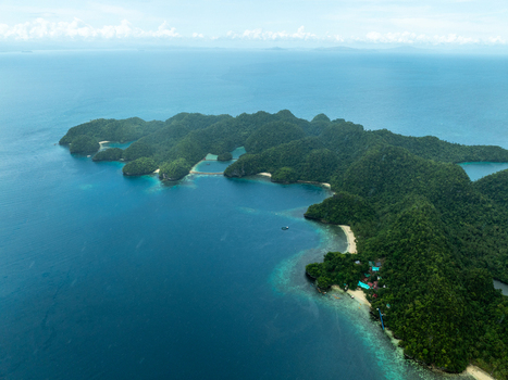 Aerial view of Bucas Grande islands featuring lush green vegetation turquoise waters and small sandy beaches in Siargao Philippines. Aerial view of Bucas Grande islands featuring lush green vegetation turquoise waters and small sandy beaches in Siargao Philippines.