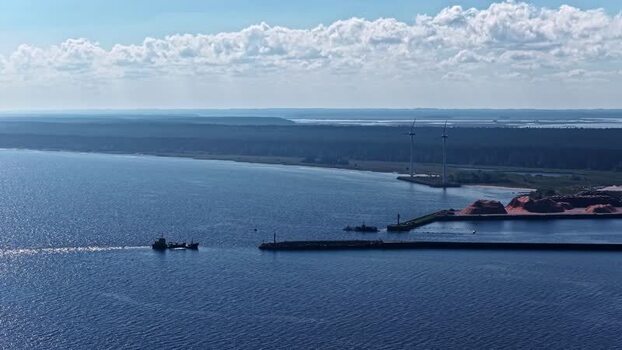Aerial view of cargo ship entering harbor Latvia. Aerial view of cargo ship entering harbor Latvia.