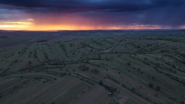 Aerial view of rolling vineyards and storm clouds Czechia.
