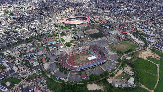 Aerial view of National Stadium Surulere Lagos surrounded by dense urban housing and city streets Lagos Lagos Nigeria. Aerial view of National Stadium Surulere Lagos surrounded by dense urban housing and city streets Lagos Lagos Nigeria.