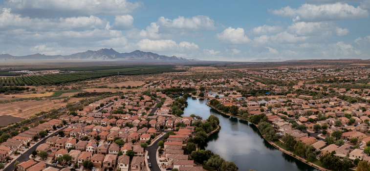 Aerial view of Sahuarita Lake and surrounding residential development in Sahuarita Arizona where a central lake contrasts with the arid desert landscape.