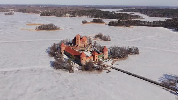 Aerial view of Trakai Castle on frozen lake Lithuania.