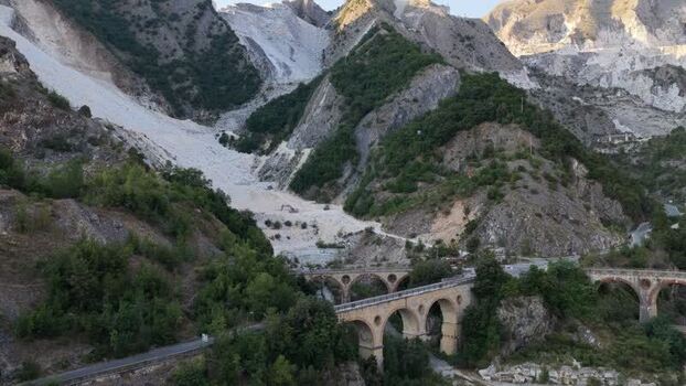 Aerial view of Carrara marble quarries and stone bridge Italy. Aerial view of Carrara marble quarries and stone bridge Italy.