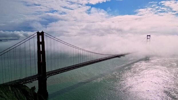 Aerial view of Golden Gate Bridge shrouded in fog United States.