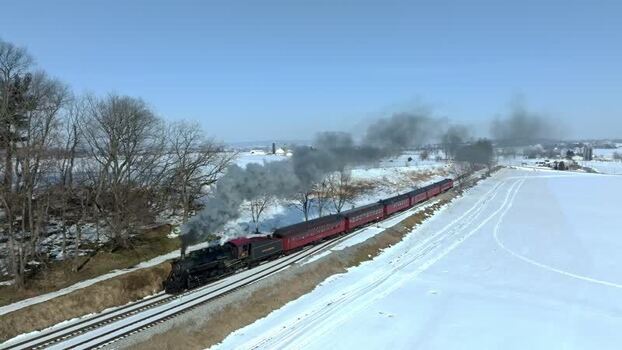 Aerial view of steam train in snowy Pennsylvania United States. Aerial view of steam train in snowy Pennsylvania United States.