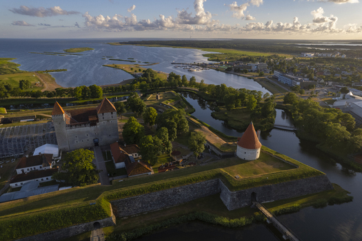 Aerial view of Kuressaare Castle surrounded by historic stone walls moats and lush green grounds near the Baltic Sea coast in Kuressaare Saare County Estonia.