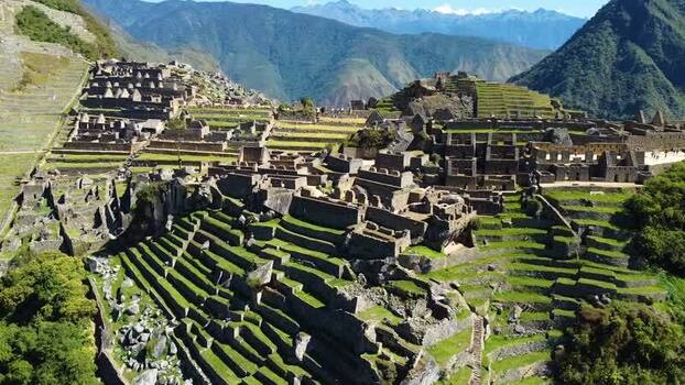 Aerial view of Machu Picchu ruins in the mountains of Peru. Aerial view of Machu Picchu ruins in the mountains of Peru.