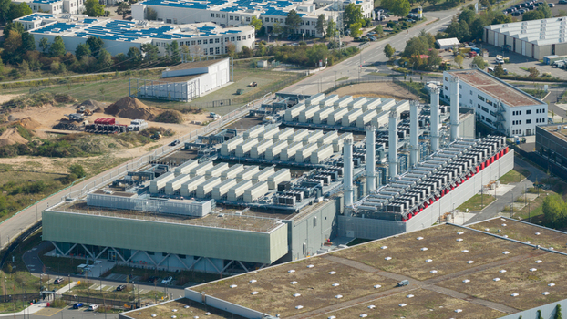 Aerial view of a modern industrial power plant facility with cooling towers technical equipment and surrounding infrastructure in Dietzenbach Hessen Germany. Aerial view of a modern industrial power plant facility with cooling towers technical equipment and surrounding infrastructure in Dietzenbach Hessen Germany.