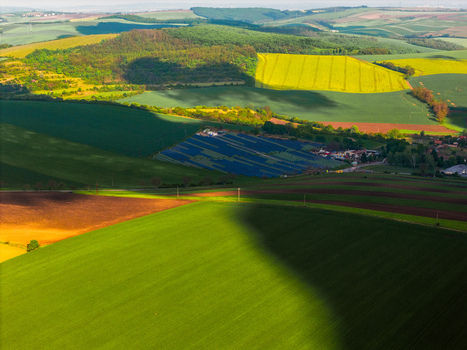 Aerial view of the FVE Bohumilice solar power plant nestled among rolling green hills and agricultural fields with dramatic cloud shadows Klobouky u Brna Jihomoravsky kraj Czechia. Aerial view of the FVE Bohumilice solar power plant nestled among rolling green hills and agricultural fields with dramatic cloud shadows Klobouky u Brna Jihomoravsky kraj Czechia.