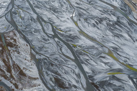 Aerial view of snow melting along Spiti river near Kaza township Himachal Pradesh India.