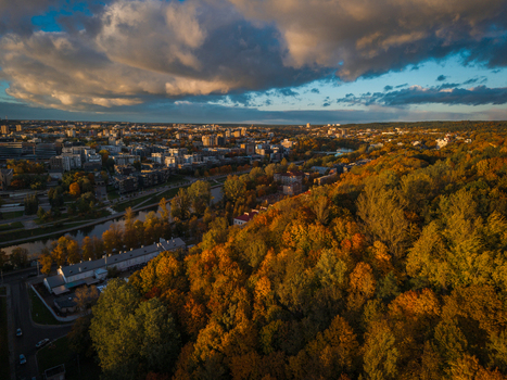 Aerial view of Vilnius reveals a vibrant tapestry where autumnal forests meet the urban skyline under a dramatic sky Vilnius Lithuania. Aerial view of Vilnius reveals a vibrant tapestry where autumnal forests meet the urban skyline under a dramatic sky Vilnius Lithuania.