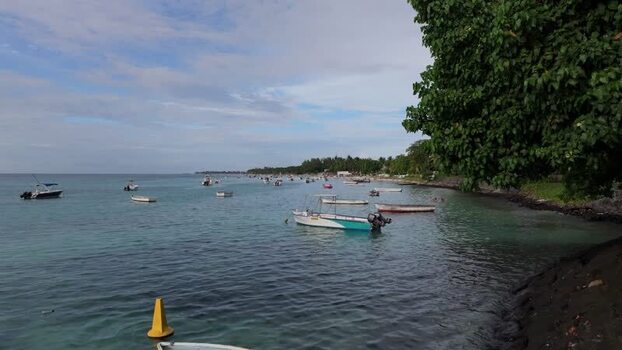 Aerial view of Trou aux Biches Beach with boats Mauritius.