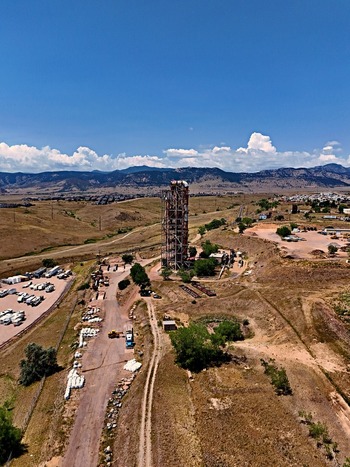 Aerial view of the historic Leyden coal mine tipple structure surrounded by arid landscape dirt roads and distant mountains in Jefferson County Colorado United States. Aerial view of the historic Leyden coal mine tipple structure surrounded by arid landscape dirt roads and distant mountains in Jefferson County Colorado United States.
