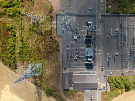 Aerial view of Eaton Socon Substation featuring electrical infrastructure and power lines in St. Neots England United Kingdom. Aerial view of Eaton Socon Substation featuring electrical infrastructure and power lines in St. Neots England United Kingdom.
