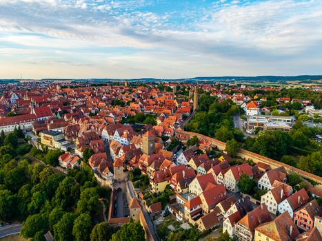 Aerial view of Rothenburg ob der Tauber with historic medieval architecture red tiled rooftops and ancient city walls in Rothenburg ob der Tauber Bavaria Germany. Aerial view of Rothenburg ob der Tauber with historic medieval architecture red tiled rooftops and ancient city walls in Rothenburg ob der Tauber Bavaria Germany.