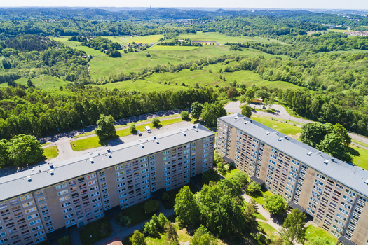 Aerial view of Rannebergen residential area with apartment blocks surrounded by lush green forests and meadows in Gothenburg Vastra Gotaland County Sweden. Aerial view of Rannebergen residential area with apartment blocks surrounded by lush green forests and meadows in Gothenburg Vastra Gotaland County Sweden.