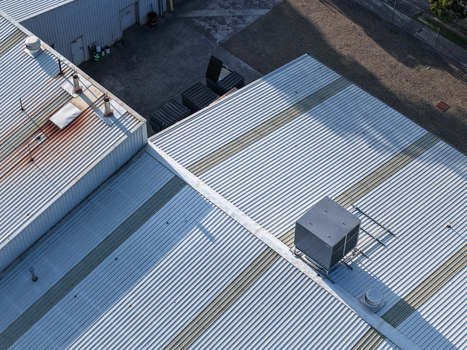 Kilsyth VIC Australia 22 September 2026 Aerial view of factories with corrugated metal roofs and ventilation units in an industrial area. Kilsyth VIC Australia 22 September 2026 Aerial view of factories with corrugated metal roofs and ventilation units in an industrial area.