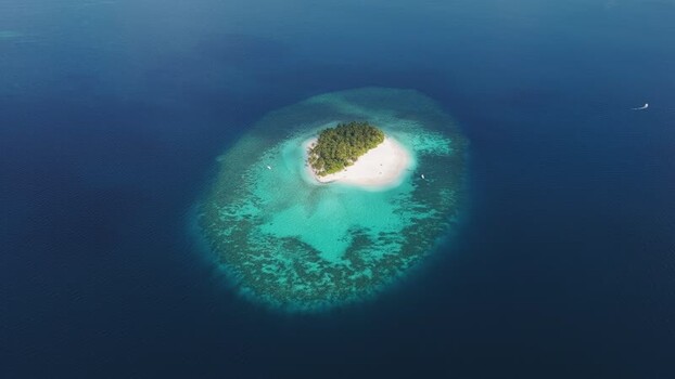 Aerial view of a tropical island and coral reef Maldives. Aerial view of a tropical island and coral reef Maldives.