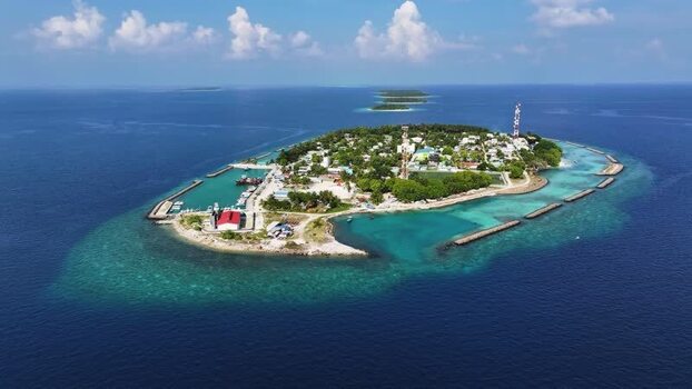 Aerial view of Kendhoo island with its harbor and coral reefs Maldives. Aerial view of Kendhoo island with its harbor and coral reefs Maldives.