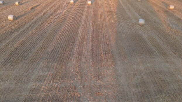 Aerial view of hay bales in a harvested field Switzerland.