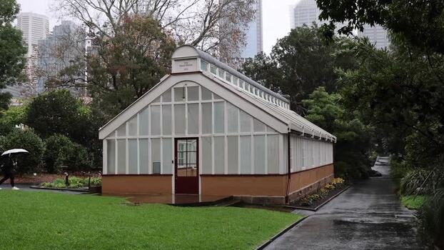 View of the historic glasshouse in the Royal Botanic Garden Australia.
